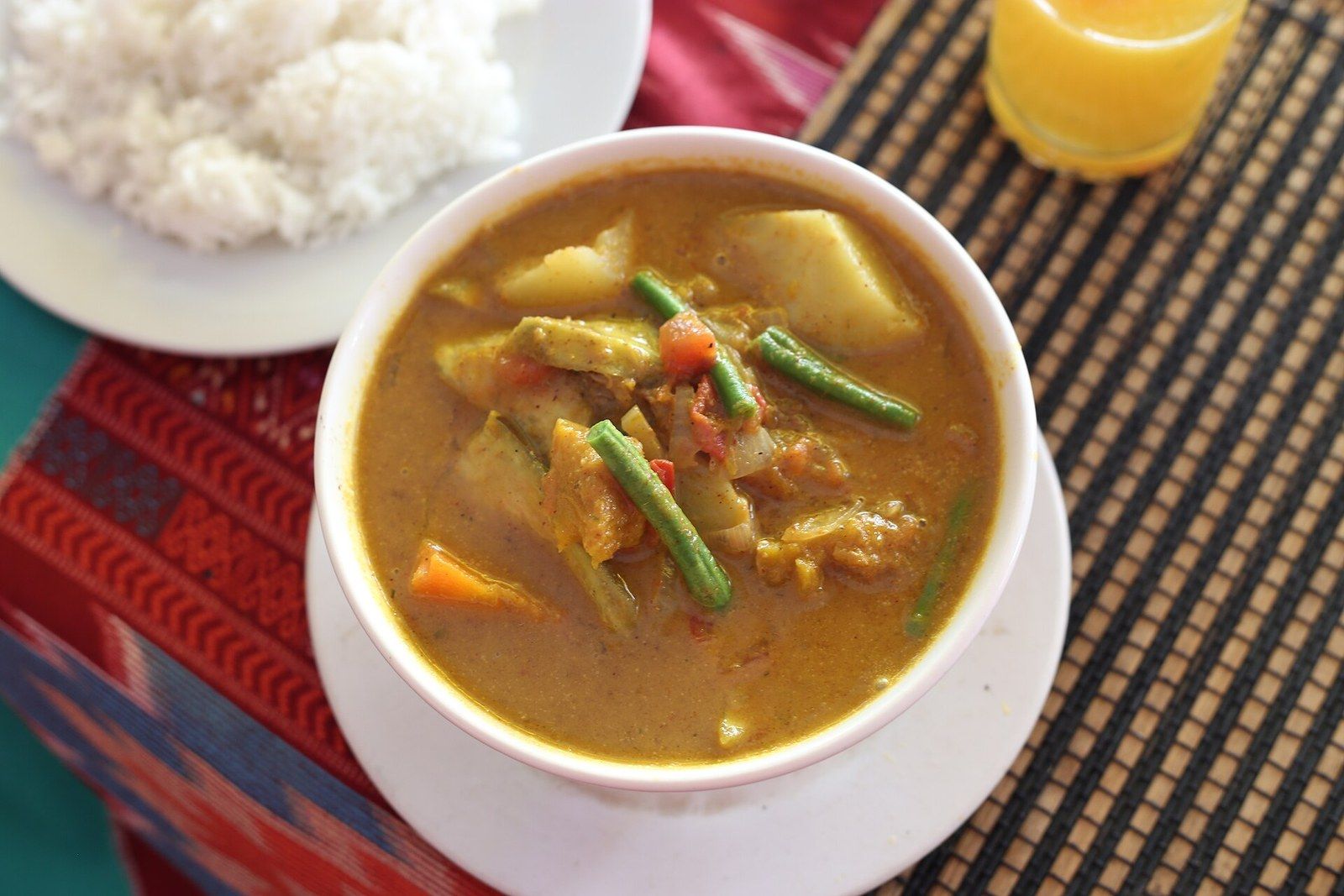 Cambodian red chicken curry served in a bowl